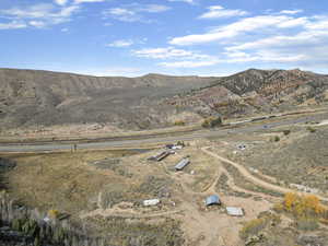 View of mountain backdrop with rural landscape