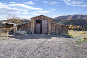 View of outbuilding with a mountain view