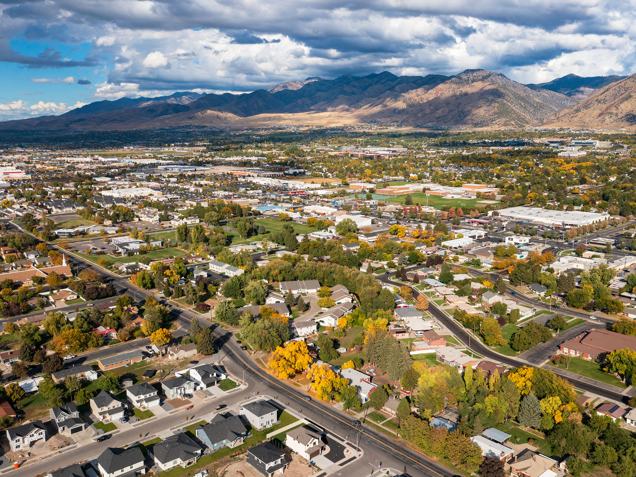 View of property location with a mountainous background and nearby suburban area