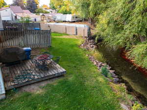 View of yard with a deck