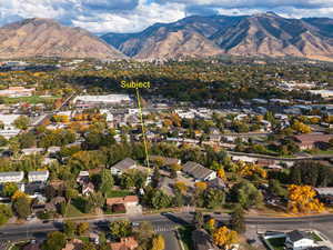 View of property location featuring a mountainous background and nearby suburban area