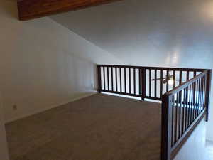 Stairway with carpet floors and a ceiling fan