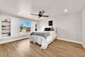 Bedroom with a ceiling fan, recessed lighting, and light wood finished floors