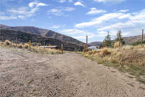 View of mountain backdrop with rural landscape