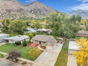 Aerial perspective of suburban area with a mountain backdrop