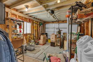 Garage featuring a garage door opener