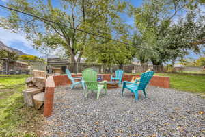 Fenced backyard with a patio