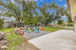 Fenced backyard with a patio area