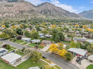 Aerial perspective of suburban area featuring a mountainous background