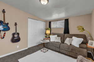 Living room featuring baseboards and carpet floors