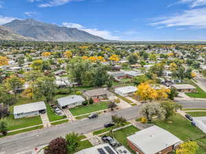 Aerial perspective of suburban area with a mountainous background