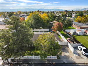 Aerial perspective of suburban area with a mountainous background