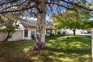 View of front of home with a shingled roof