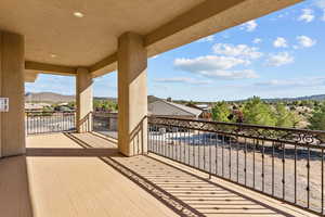 Balcony featuring a residential view and a mountain view