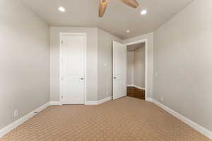 Unfurnished bedroom featuring light carpet, recessed lighting, and ceiling fan