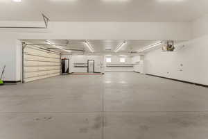 Garage featuring baseboards