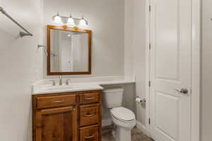 Full bathroom featuring vanity and toilet