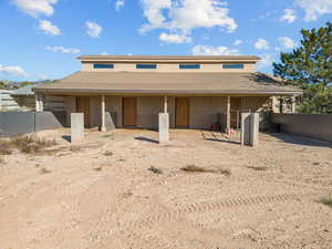 Back of house with stucco siding