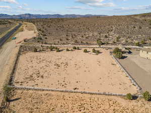 View of rural area with a mountainous background and a desert landscape