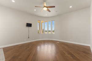 Spare room with recessed lighting, dark wood-style flooring, and ceiling fan