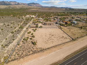 Aerial view of residential area featuring a mountainous background