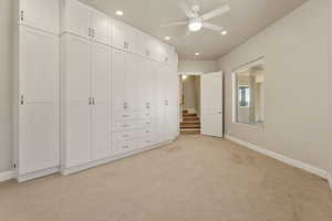 Unfurnished bedroom with light carpet, recessed lighting, and a ceiling fan