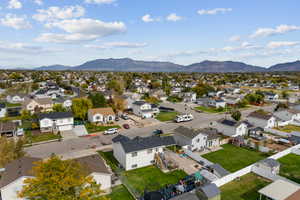 Aerial view of residential area featuring a mountain backdrop