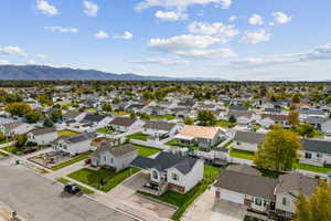 Aerial perspective of suburban area with a mountain backdrop