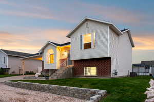Split level home with brick siding