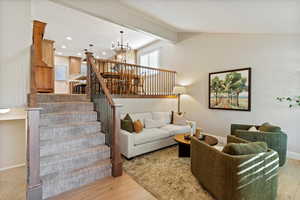 Remodeled Living Space with Laminate Flooring, beautiful new banister.