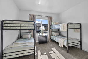 Carpeted bedroom with baseboards