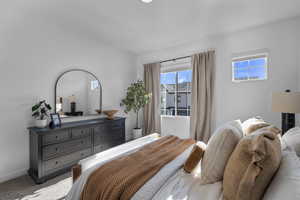 Carpeted bedroom featuring baseboards