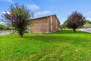 View of side of home featuring brick siding