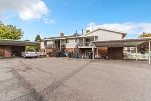 View of front of property featuring stairway and a chimney