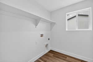 Laundry room with dark wood-type flooring, hookup for a washing machine, and electric dryer hookup