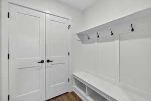 Mudroom with dark wood-type flooring