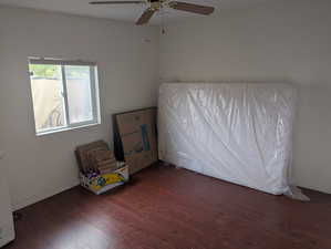 Unfurnished bedroom with wood finished floors and ceiling fan