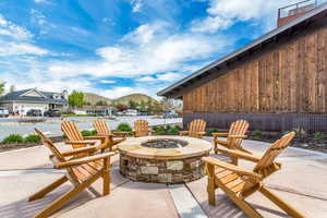 View of patio / terrace featuring a fire pit and a mountain view