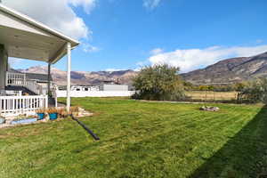 View of yard with a mountain view and stairs