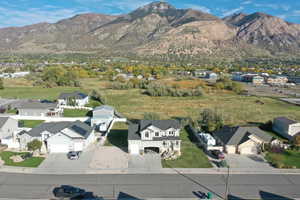 Aerial view of residential area featuring a mountain backdrop