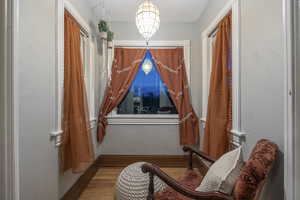 Sitting room featuring wood finished floors and baseboards