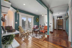 Sitting room featuring hardwood / wood-style floors, french doors, and recessed lighting