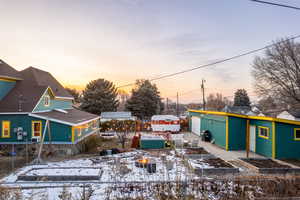 View of front facade with a patio area and a garden