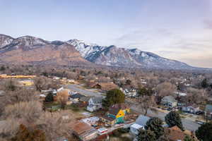 Aerial view of residential area featuring mountains