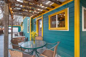 View of patio with outdoor dining area