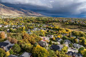 Aerial perspective of suburban area with a mountainous background