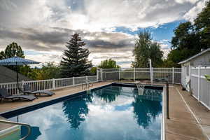 View of swimming pool featuring a patio