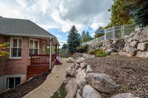 View of yard with covered porch
