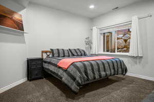 Bedroom with carpet flooring and recessed lighting