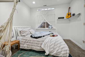 Bedroom featuring carpet floors and recessed lighting